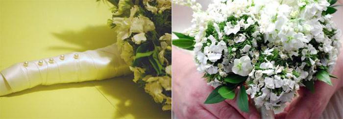 букет из белых гвоздик с лентой и бусинками